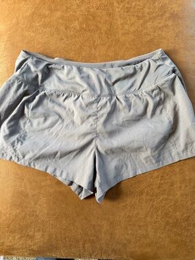 Nike Women's Light Gray Athletic Running Shorts with Subtle Swoosh